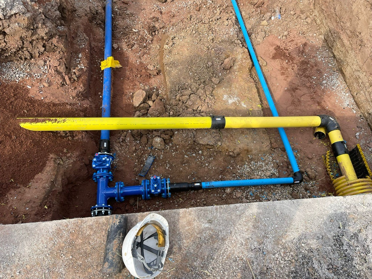 Gas and water pipes in a trench