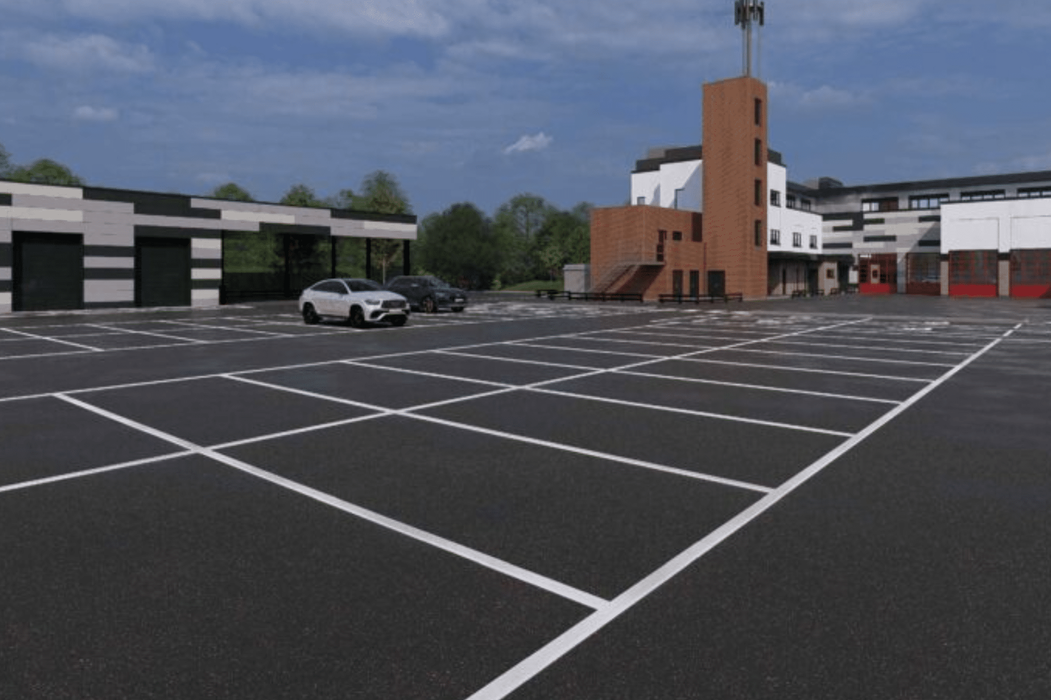 CGI of the proposed Moulton fire station redevelopment featuring appliance bays, white and grey cladding, and training structures.